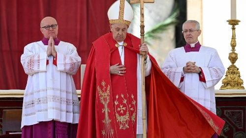 Pope Francis prays at Palm Sunday Mass in St. Peter's Square